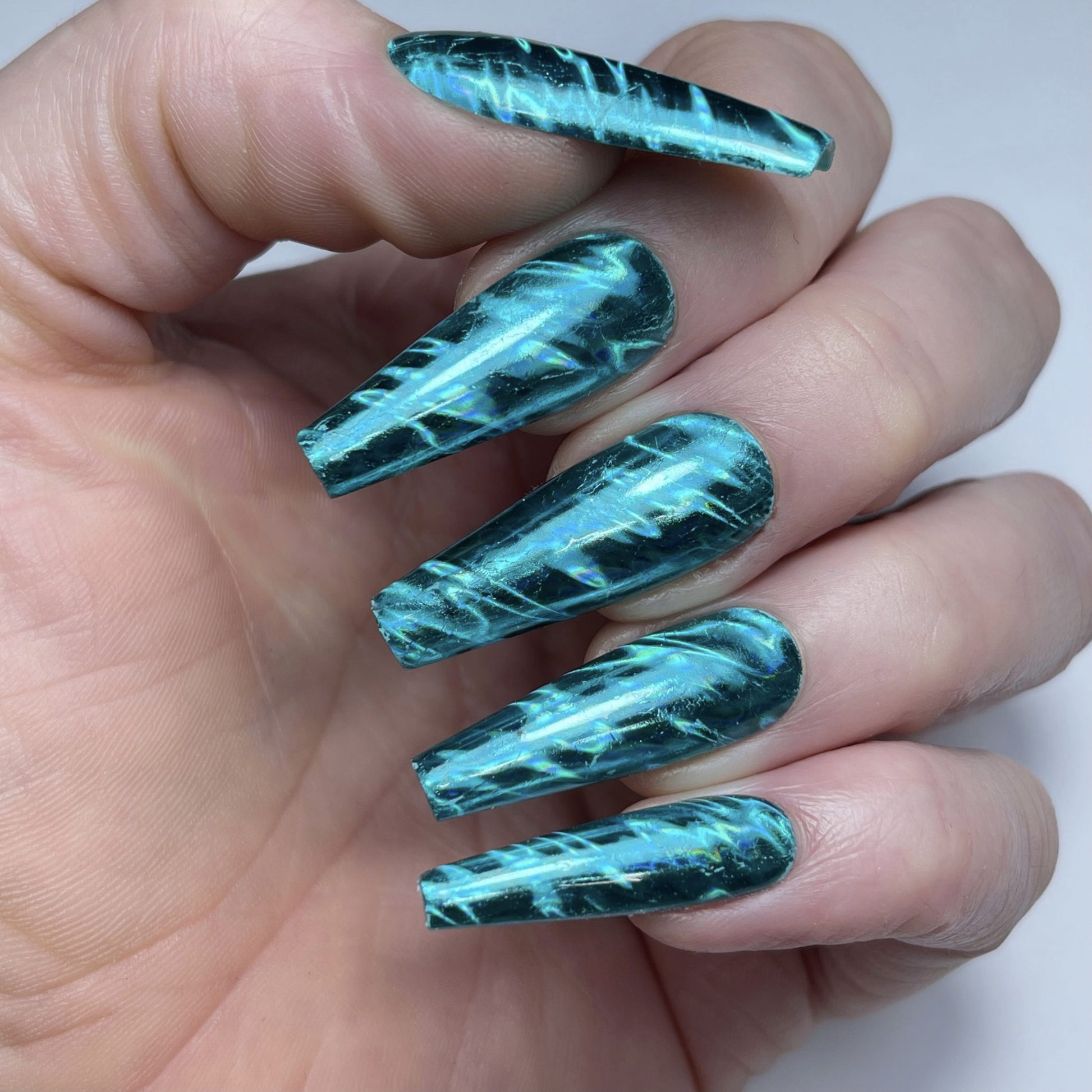 turquoise waves foil on hands